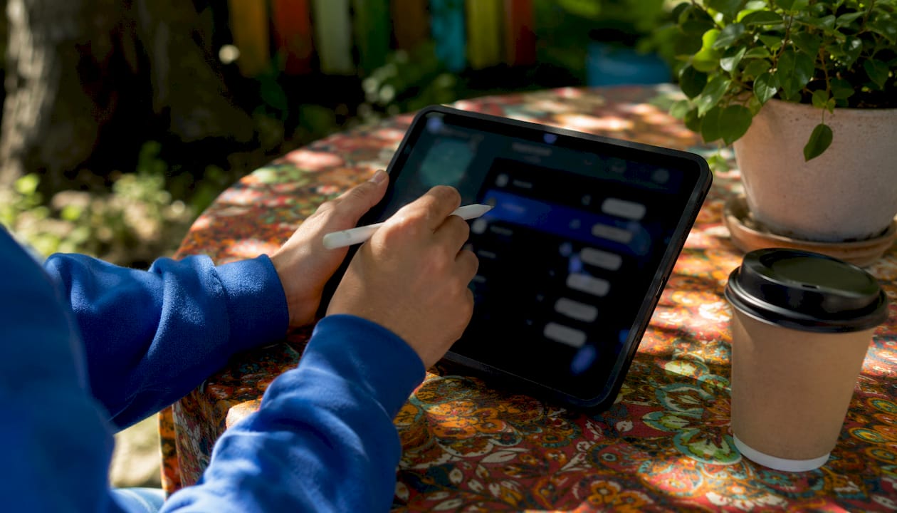 Hands interacting with monetization tools on tablet